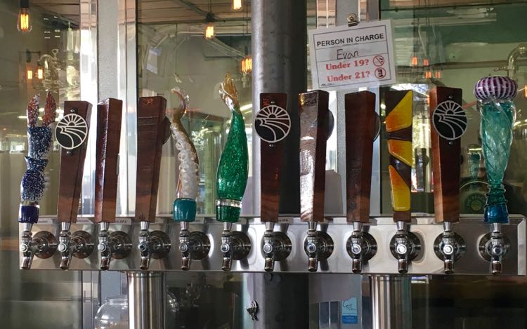 cool beer taps at Big Beach Brewing in Gulf Shores AL. Article and photo by Charles McCool for McCool Travel.