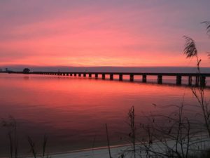 catch a Coastal Mississippi sunset next to Biloxi Bay Bridge